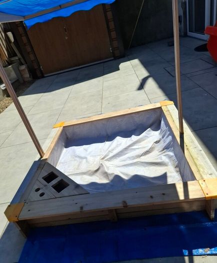 sand pit with canopy roof