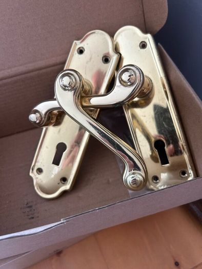 Nine sets of secondhand brass doors handles