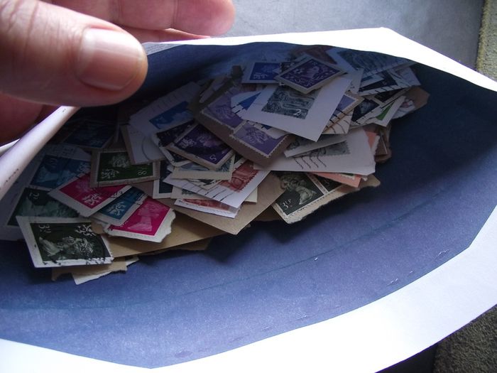 A box with collection of stamps from Great Britain