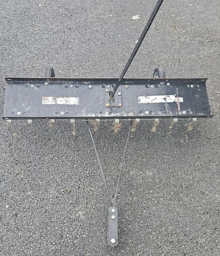 Tow behind lawn dethatcher