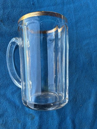 Vintage pint glass in leather holder