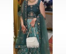 Green lehenga with beautiful multicoloured embroidery