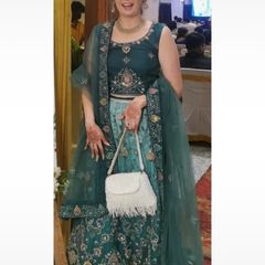 Green lehenga with beautiful multicoloured embroidery