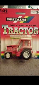Vintage British diecast Tractor model ..the red turner