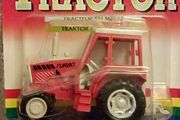 Vintage British diecast Tractor model ..the red turner