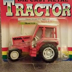 Vintage British diecast Tractor model ..the red turner
