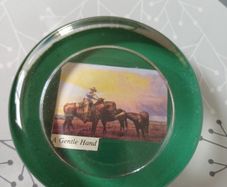 selection of paper weights. with different photos