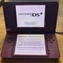 Nintendo DSi XL burgundy with Super Mario Image 3