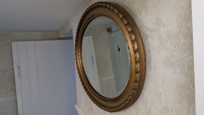Ornate oval mirror