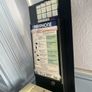 old style payphone. Phone Money vault was opened. Steel bent and open Image 2