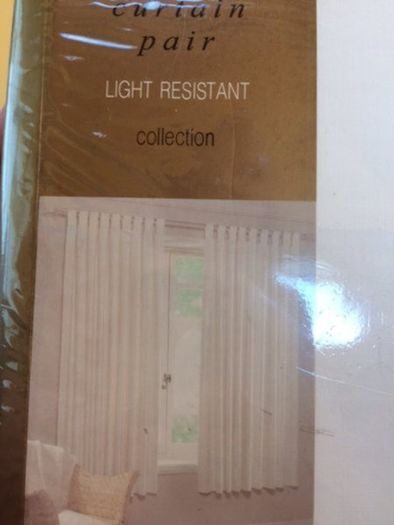 Tab top.Light resistant ivory curtains.168 x 183cm