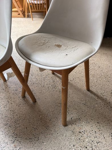 Two white bucket chairs