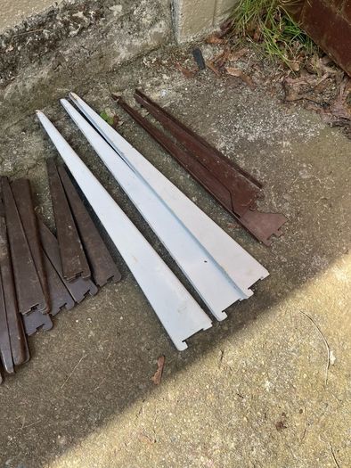 Adjustable shelving rails and brackets