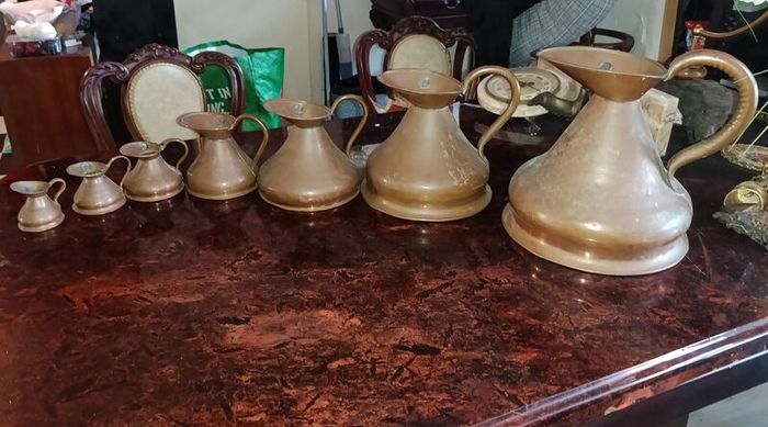 Antique Haystack copper jug set of 7
