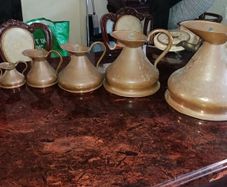 Antique Haystack copper jug set of 7