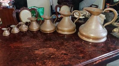 Antique Haystack copper jug set of 7