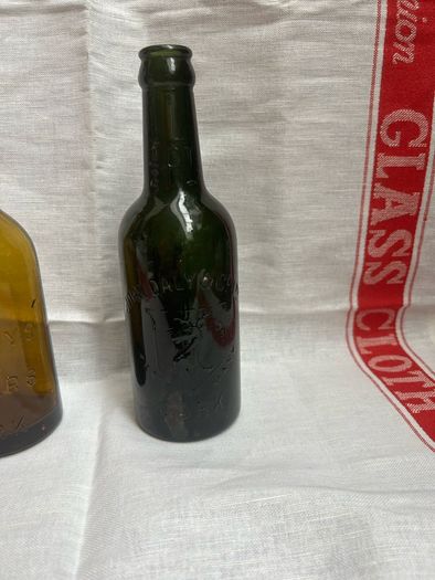 Antique Cork Advertising Bottles x2