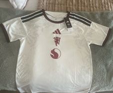 Manchester United home, away and third kits