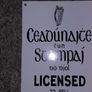 Irish antique style Enamel and Metal Sign. Licensed to Sell Stamps Image 2