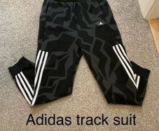 Adidas track suit pants, 15 to 16, never worn