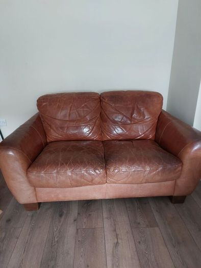 2 seater brown leather sofa. Approx 150cm width, approx 90cm breadth/ from back to front