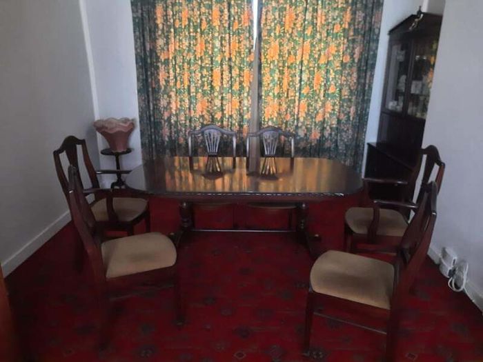 Antique mahogany dining table and chairs