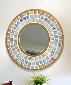 Round mosaic mirror with handcrafted blue and peach mosaic tiles