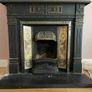Late Victorian / early Edwardian style cast iron fireplace with tiled inserts and a decorative mantel surround Image 2