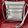 Silver crossbody handbag with contrasting gold zips & hardware  In excellent condition. Purchased in Toulouse Image 6