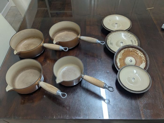Le Creuset pots cast iron with lids and storage