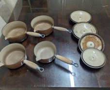 Le Creuset pots cast iron with lids and storage
