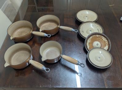 Le Creuset pots cast iron with lids and storage