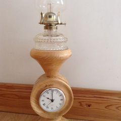 Wooden oil lamp with clock