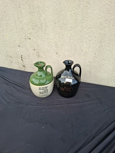 Duo whiskey bottles possible to post