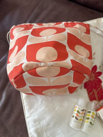 A Bundle of Orla Kiely Products - Bergamot Mini bath and hand set , a pull string wash bag, 2 empty body lotion and conditioner and a limited edition travel porcelain cup for Kenco