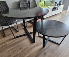 Round dining table with a matching coffee table