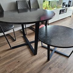 Round dining table with a matching coffee table