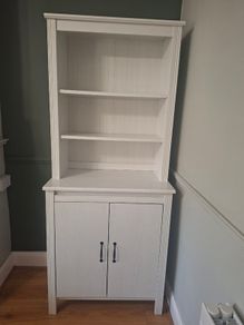 White wooden dresser with shelving
