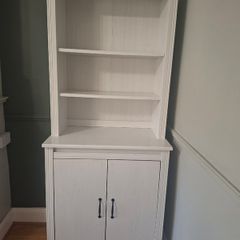 White wooden dresser with shelving