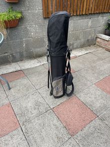 Left hand golf clubs and stand