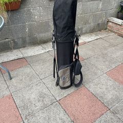 Left hand golf clubs and stand
