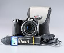 Nikon Coolpix L110, a black bridge-style digital camera
