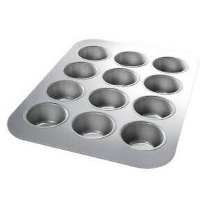 Bakeware/Chicago Metallic 12 Hole Mini Muffin Tin with Loose Bases/Cupcake Tray/Two Sponge Cake Trays/Cooling Rack .. Price is Now 33.00euro all 5 pieces