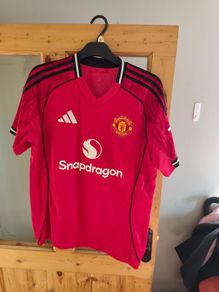 Assortment of Manchester United Jersey's.