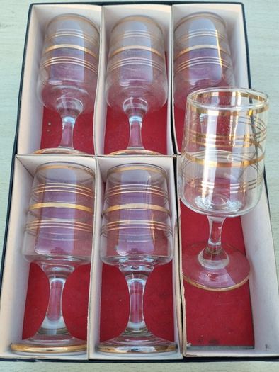 The set features six vintage vodka or liqueur glasses.