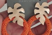 Bright earrings.