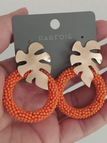 Bright earrings.
