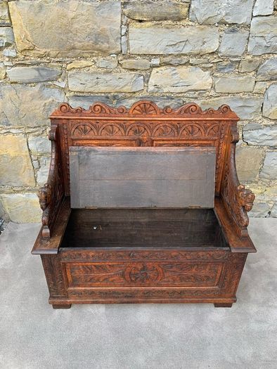 Late Victorian Gothic Revival Carved Oak Hall Settle.