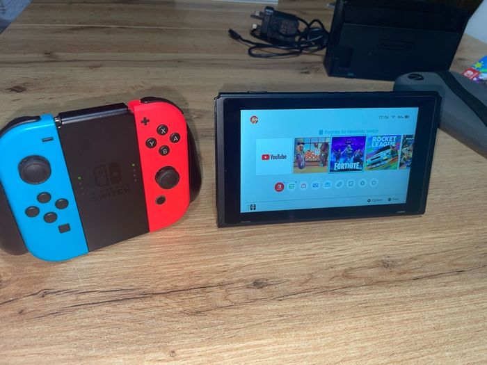 Nitendo switch, including 2 games, splatoon 2 & Mario kart deluxe and accessories too.