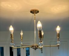 Two brass chandeliers